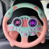 Rosa und mintgrünes Spielzeuglenkrad mit digitalem Display für Geschwindigkeit und Drehzahl, an einem Autositz befestigt Náhľad obrázku produktu