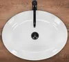 A top-down view of a white basin with a black faucet and drain, set against a wooden background. Produktbild-Vorschau