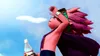 A character from Sand Land is holding a bottle of water and wiping sweat from their brow under a bright blue sky with clouds. Podgląd zdjęcia produktu