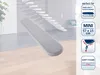 A mini ironing board cover is shown in a room with stairs and furniture in the background. Produktbild-Vorschau