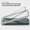 A screen protector being installed onto a smartphone using an alignment tool. Podgląd zdjęcia produktu