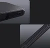 Close-up shots of a black phone case with a ribbed texture and cutouts for ports. Náhled obrázku produktu