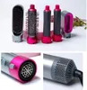 A set of hair styling attachments and a hair dryer nozzle, displayed on a white background with some floral elements in the background. Produktbild-Vorschau