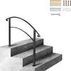 A black metal handrail installed on outdoor concrete steps. Voir les images du produit