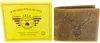 A brown leather wallet with a deer head embossed on it, next to its yellow packaging box. Produktbild-Vorschau