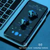 A smartphone displaying a music app with earbuds on the screen, placed on a laptop keyboard. Produktbild-Vorschau