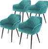 Four teal dining chairs with diamond tufting and black metal legs are arranged on a white background. Produktbild-Vorschau