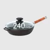A cast iron frying pan with a glass lid and a wooden handle is shown against a plain background. Dimensions are indicated on the lid. Produktbild-Vorschau
