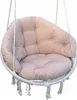 A close-up studio shot of a beige hanging chair cushion with white rope details and tassels. Produktbild-Vorschau