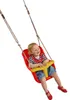 A baby sitting in a red and yellow baby swing. Produktbild-Vorschau