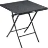 A black folding table with a polyrattan top and metal legs, shown against a white background. Produktbild-Vorschau