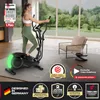 A woman is using a black elliptical machine in a well-lit room with a large window overlooking a green landscape. There are several marketing badges and text overlays on the image. Produktbild-Vorschau