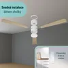 A ceiling fan assembly diagram on a gray wall background with a close-up inset of a remote control and its wall mount. Náhled obrázku produktu