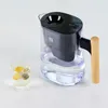 A water filter pitcher and a glass of water with fruit slices. Náhľad obrázku produktu