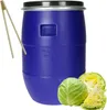 A blue plastic barrel with a black lid, along with a pair of wooden tongs and some cabbages. The scene appears to be set up for food preservation or fermentation. Produktbild-Vorschau
