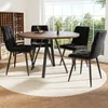 A round dining table with four black chairs set up in a dining room with a large window in the background. Anteprima dell’immagine prodotto
