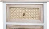 A close-up view of the top two drawers of a white and wood-toned dresser with rattan drawer fronts. Anteprima dell’immagine prodotto