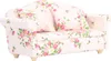 A miniature sofa with a floral pattern. Náhled obrázku produktu