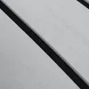 A close-up, angled view of a textured gray material with a black stripe running diagonally across it. Náhled obrázku produktu