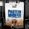 A product package for protein powder displayed in a gym setting. Produktbild-Vorschau