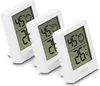 Three white digital thermometers/hygrometers are arranged in a diagonal line on a white background. Anteprima dell’immagine prodotto