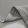A close-up of gray fabric, showing the texture and stitching of a curtain. Produktbild-Vorschau
