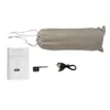 A set of items for a portable coffee maker, including a manual, a scoop, and a charging cable, all laid out on a white background. A grey drawstring bag containing the coffee maker is also present. Produktbild-Vorschau