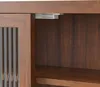 A close-up view of the top corner of a wooden cabinet with a glass door and a sliding mechanism. Produktbild-Vorschau