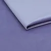 A close-up view of folded fabric with a gradient of purple and light purple hues. Náhled obrázku produktu