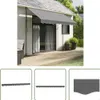 An awning is installed on the side of a house, extending over a wooden deck. Produktbild-Vorschau