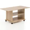 A light brown wooden coffee table with two shelves and wheels, shown against a white background. Produktbild-Vorschau