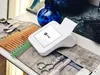 A payment terminal and barber tools are arranged on a surface. Anteprima dell’immagine prodotto