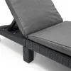 A close-up view of a gray chaise lounge with a woven black frame. Produktbild-Vorschau
