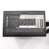 A black computer power supply unit with a label showing its specifications. Produktbild-Vorschau