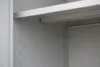 Close-up view of the inside of a metal cabinet shelf. Produktbild-Vorschau