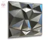 A square panel with a geometric, faceted design, resembling brushed metal. Produktbild-Vorschau