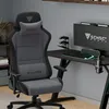 A gaming chair and desk setup in a room. Produktbild-Vorschau