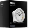 A white Braun radio-controlled alarm clock is displayed on the front of its black packaging. Voir les images du produit