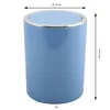 A pastel blue trash can with a silver rim and lid, shown with dimensions indicated by arrows and text. Voir les images du produit