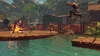 A group of people in a video game are in action on a wooden platform over water, with buildings and foliage in the background. Produktbild-Vorschau