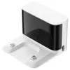 A white and black charging dock for a robot vacuum cleaner, shown from a slightly elevated angle against a white background. Voir les images du produit