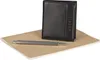 A black leather wallet, a silver pen, and a brown notebook are arranged on a white background. Produktbild-Vorschau