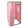 A pink changing room with a towel hanging on a rack and a toilet inside. Voir les images du produit