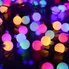 A close-up shot of a string of colorful LED ball lights. Produktbild-Vorschau