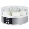 A yogurt maker with multiple glass jars filled with yogurt, placed on a white background. Produktbild-Vorschau