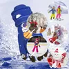 A blue glove with a space-themed pattern is shown in the foreground, surrounded by circular insets depicting children engaged in winter activities like skiing, ice skating, playing in the snow, and building a snowman. Produktbild-Vorschau