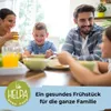 A family is enjoying breakfast together at a table. Podgląd zdjęcia produktu