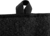A close-up view of the top edge of a black fabric product with a black loop attached. Produktbild-Vorschau