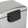 Close-up of a black handle on a silver trash can lid. Náhled obrázku produktu