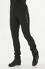 A person wearing black pants and boots against a white background. Produktbild-Vorschau